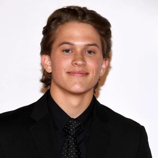 Medium Length Bro Flow hairstyle for oval face shape - men's medium wavy hair