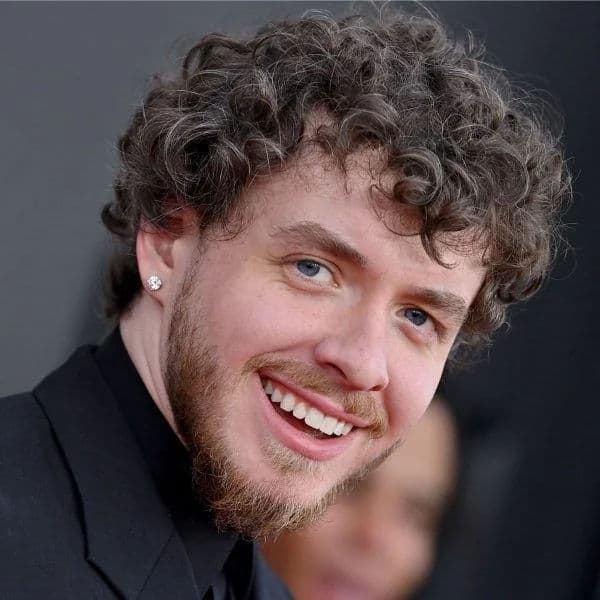 Messy Curly Fringe hairstyle for oval face shape - men's medium curly hair