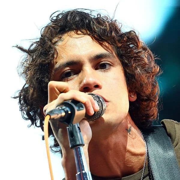 Messy Curly Shag hairstyle for oval face shape - men's medium curly hair