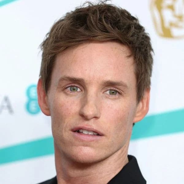 Messy Textured Quiff hairstyle for oval face shape - men's short wavy hair