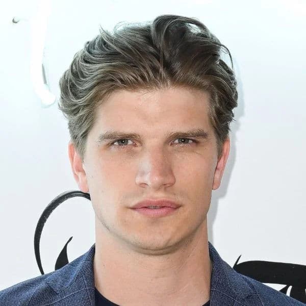 Modern Tapered Brush Back hairstyle for oval face shape - men's short wavy hair