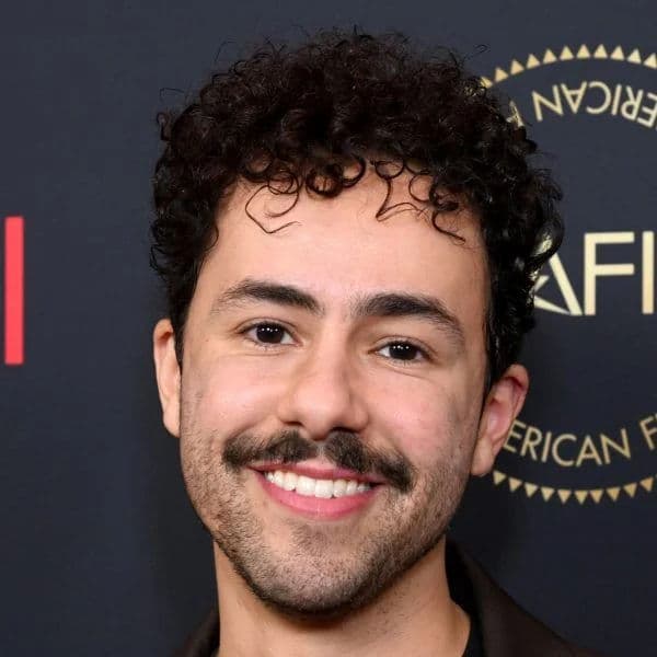 Short Curly Taper Cut hairstyle for oval face shape - men's short curly hair