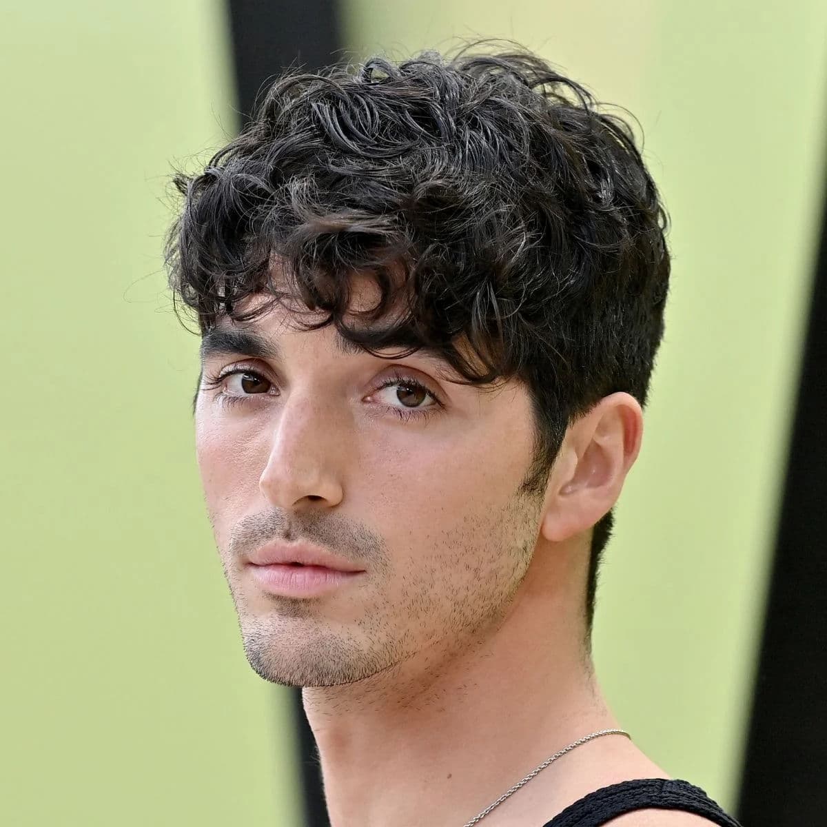 Textured Curly Fringe hairstyle for oval face shape - men's short curly hair