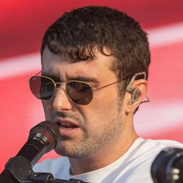 Textured French Crop hairstyle for oval face shape - men's short wavy hair