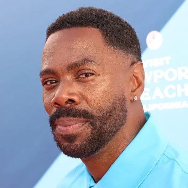 Textured Taper Fade hairstyle for oval face shape - men's short coily hair