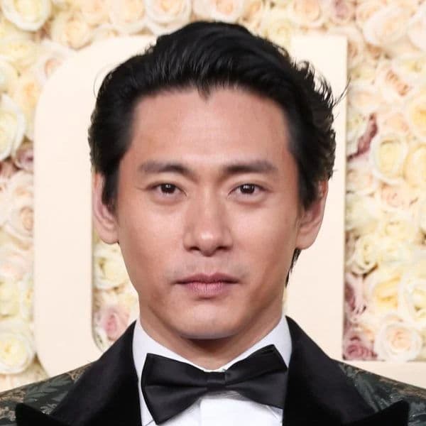 Classic Swept Back hairstyle for oval face shape - men's medium straight hair