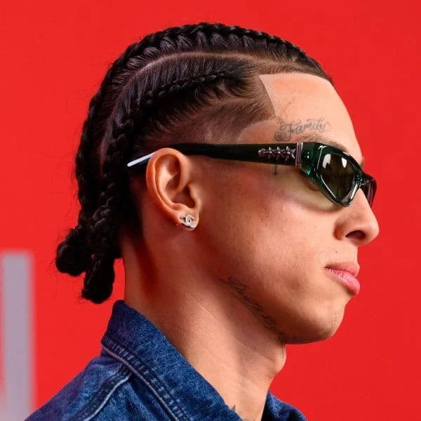 Cornrow Braids with Taper Fade and Bun hairstyle for oval face shape - men's medium-long coily hair