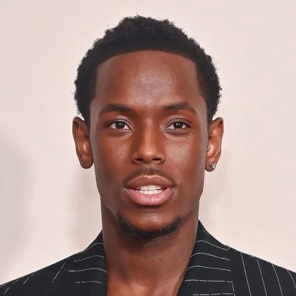 Low Taper Fade with Short Coils hairstyle for oval face shape - men's short coily hair