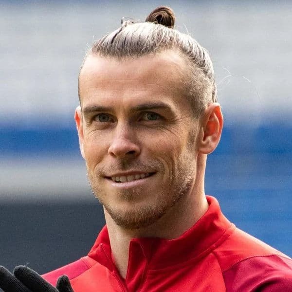 Man Bun Top Knot hairstyle for oval face shape - men's long straight hair