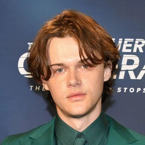 Modern Middle-Parted Flow hairstyle for oval face shape - men's medium wavy hair