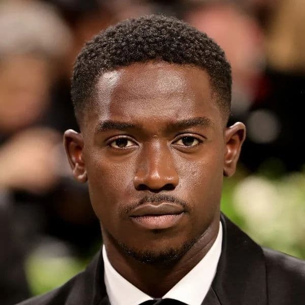 Short Afro Fade hairstyle for oval face shape - men's very-short coily hair