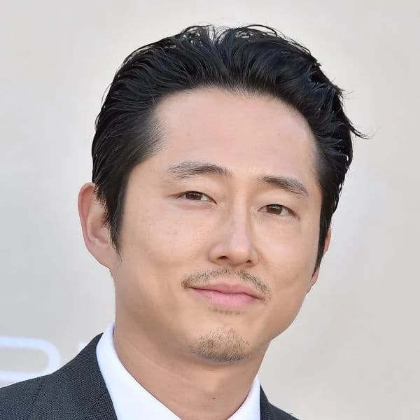 Slick Back with Natural Texture hairstyle for diamond face shape - men's medium straight hair