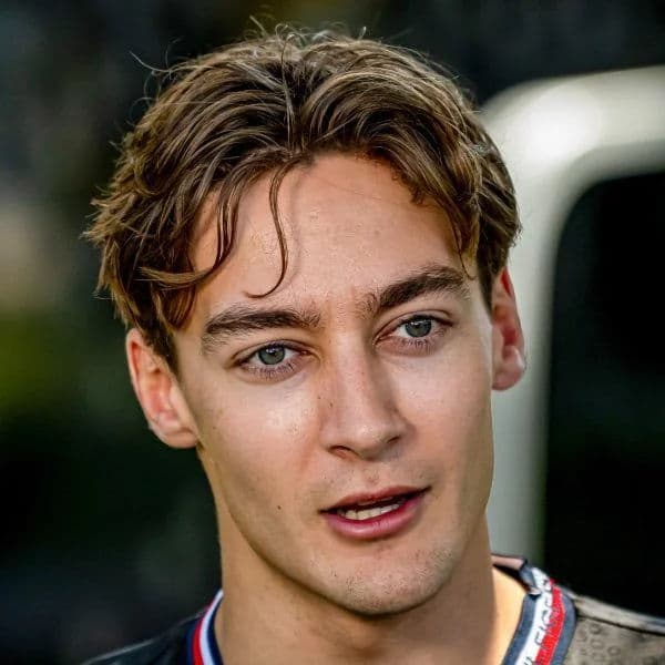 Textured Middle Part Curtains hairstyle for oval face shape - men's short wavy hair