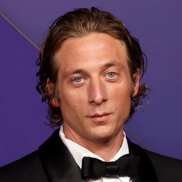 Wavy Swept Back Flow hairstyle for rectangle face shape - men's medium wavy hair