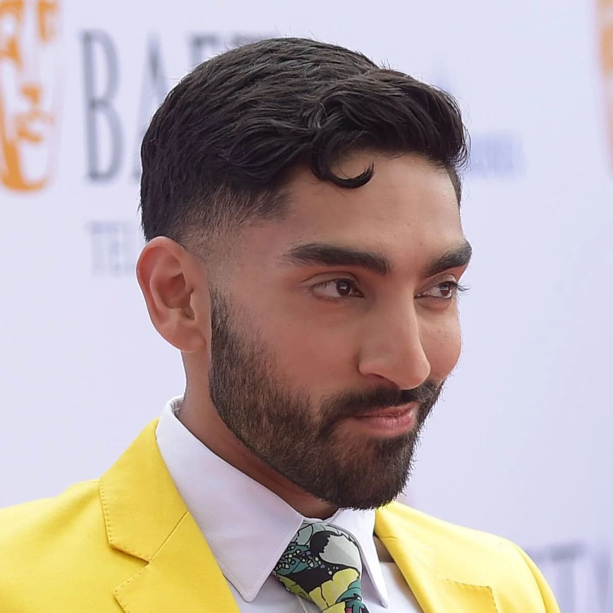 Wavy Textured Crop with Taper Fade hairstyle for oval face shape - men's short wavy hair